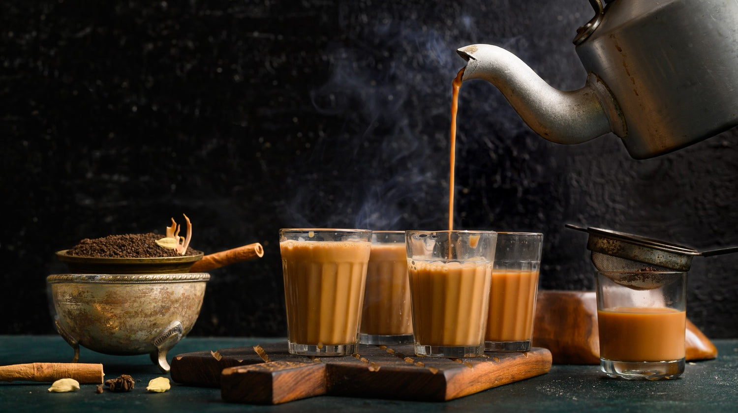 pouring hot chai in a cup